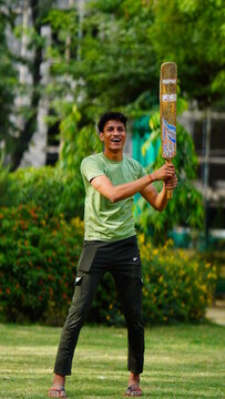 playing cricket a boy with bat cricketer image