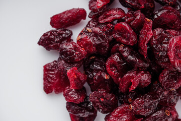 dried cranberry on a white acrylic background
