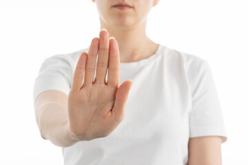 A close up image of woman doing ,,stop'' sign with her hand