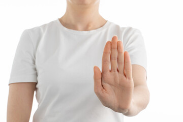 A close up image of woman doing ,,stop'' sign with her hand