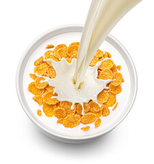 Corn flakes with pouring milk isolated on white background, top view