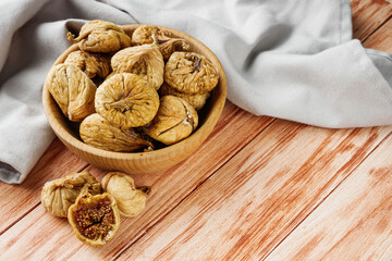 delicious dried figs on a wooden rustic background