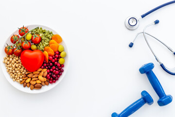 Healthy lifestyle and nutrition eating concept. Food with sports fitness equipment