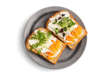 White bread sandwiches with cream cheese, calendula and microgreen isolated on white. top view, close up.