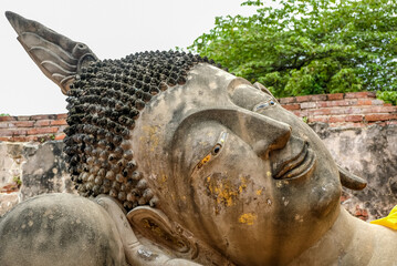 Ancient Reclining Buddha statue at Wat Phutthaisawan in Sampao Lom subdistrict, Phra Nakorn Sri Ayutthaya ,Thailand.
