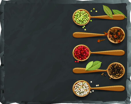 a modern black kitchen board with a composition of wooden spoons with spices.  the texture of natural stone with multicolored pepper, clove and bay leaf.