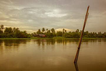 Overcast sky during sunset along Tha Chin river(Maenam Tha Chin),Nakhon Pathom,Thailand