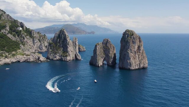Luxury Yacht Boats by Faraglioni Rocks off Island of Capri, Italy, Aerial