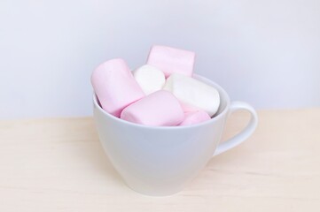 Close up of pink and white fluffy marshmallows sweet candy for tea and coffee break . High quality photo