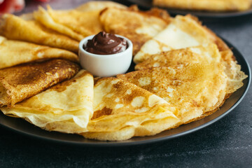 Delicious pancakes on a plate. Pancakes with chocolate