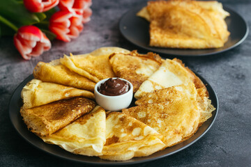 Delicious pancakes on a plate. Pancakes with chocolate