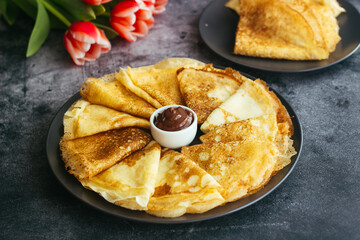 Delicious pancakes on a plate. Pancakes with chocolate