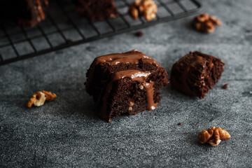 Tasty chocolate brownie. Pieces of cake on the table