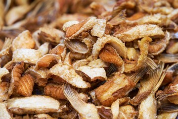 Close up pile of Crispy fried salmon skin, thai street food market