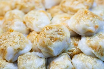 Close up of Steamed dumpling stuffed with garlic chives, Taro, yam and bamboo thai street food market