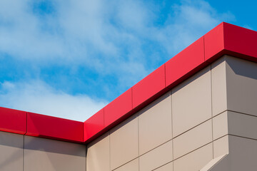 The exterior wall of a contemporary commercial style building with aluminum metal composite panels...