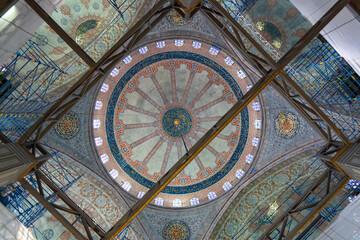 Interior of the blue mosque, with its tiles and paintings of many colors.