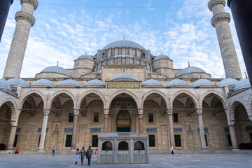 Suleiman Mosque seen from the inner courtyard, with its ablution fountain. At sunset with a blue...