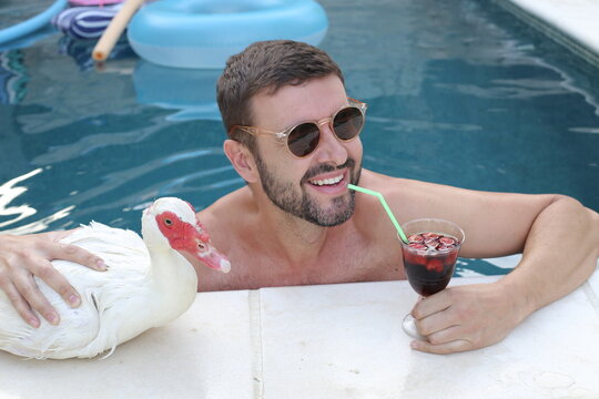 Man And His Cute Duck Pet On Vacations Together