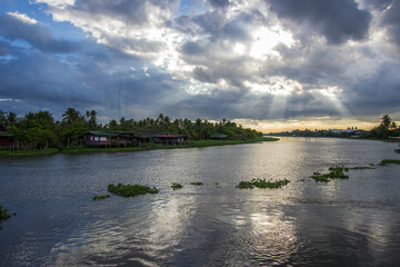Beautiful sun beams and sky over Tha Chin river(Maenam Tha Chin),Nakhon Pathom,Thailand.
