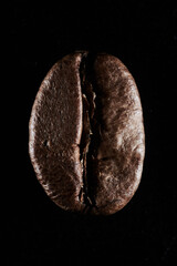 Roasted coffee beans isolated close up on black background, clipping path