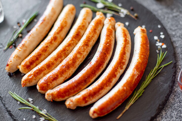 grilled sausages on a stone background