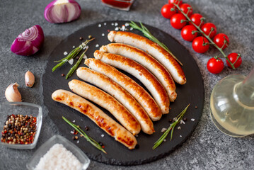 grilled sausages on a stone background