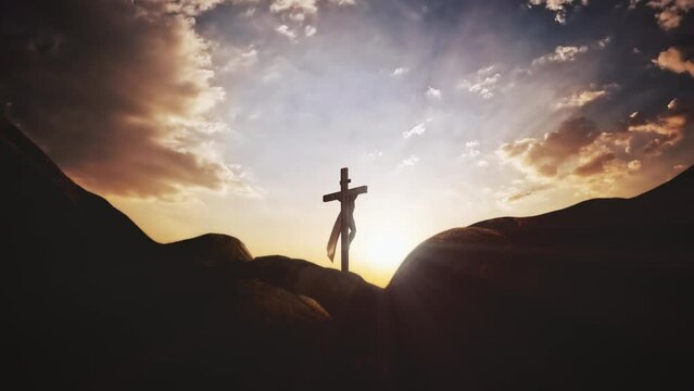 The brightly shining sky and the rays of light shining through the flowing clouds and the silhouette of the holy cross symbolizing the suffering, death and resurrection of Jesus Christ