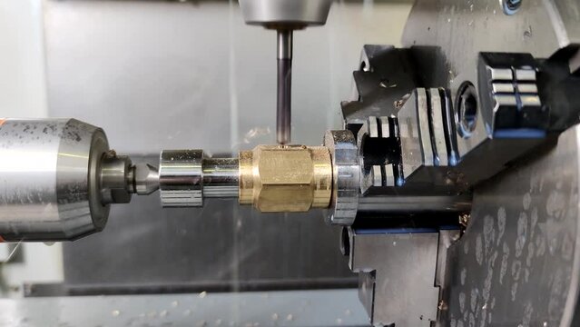 Process of vertical drilling in modern 4-axis CNC milling machine.