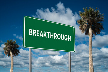 Fototapeta premium Highway sign with the word Breakthrough on a beautiful blue sky background with palm trees. Motivational concept for finding what we want on the journey of life.