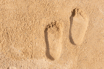 footprints on the beach sand