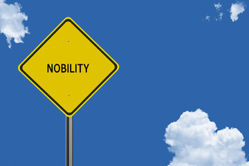 The word Nobility on a yellow road sign on a blue sky background.  Inspirational concept for success in life.