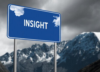Blue sky highway sign with the word Insight on a stormy mountain background.  Motivation concept for overcoming obstacles.