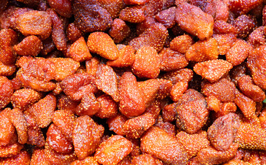 Dried strawberry pieces in bright red sugar