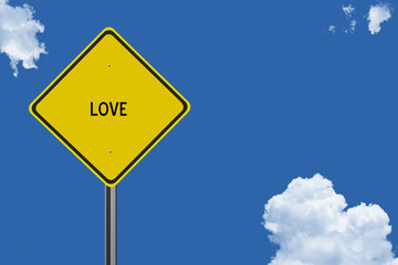 The word Love on a yellow road sign on a blue sky background.  Inspirational concept for success in life.