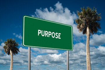 Fototapeta premium Highway sign with the word Purpose on a beautiful blue sky background with palm trees. Motivational concept for finding what we want on the journey of life.