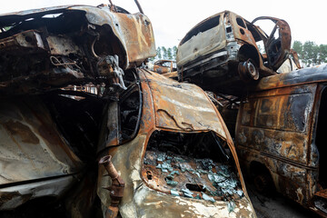 War in Ukraine. Car graveyard in Irpin. Shot cars of civilians.