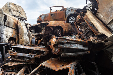 War in Ukraine. Car graveyard in Irpin. Shot cars of civilians.