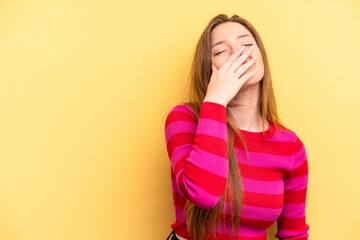 Young caucasian woman isolated on yellow background laughing happy, carefree, natural emotion.
