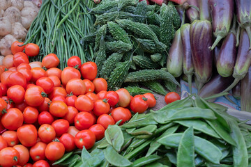 Tomato and other vegetables for sale in a market in Territy Bazar, Kolkata, West Bengal, India.