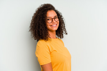 Young Brazilian woman isolated on blue background confident keeping hands on hips.