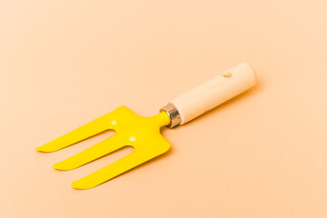 Garden tools isolated on beige background