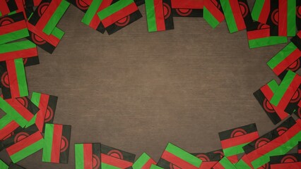 Frame made of paper flags of Malawi arranged on wooden table. National celebration concept. 3D illustration