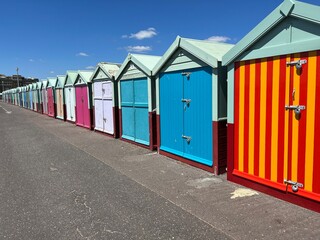 Colorful changing huts are on the beach in Hove, England near Brighton, a popular summer destination.