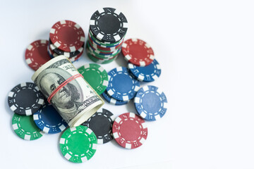Stacks of poker chips with money on white background, USD currency