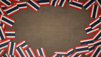 Frame made of paper flags of Thailand arranged on wooden table. National celebration concept. 3D illustration