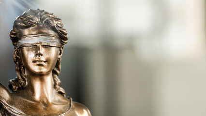 Legal and law concept statue of Lady Justice on blurred background