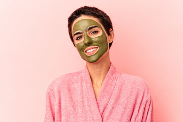 Young caucasian woman wearing a face mask isolated on pink background happy, smiling and cheerful.