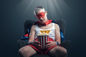 Funny superhero watching a boring movie