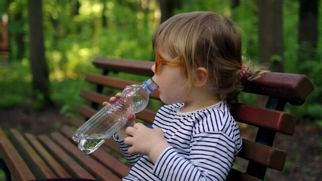 Little Girl Drinking Mineral Water Bottle Stock Photo 85221286